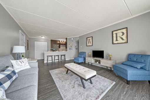Renovated Living Room with frames at Woodland Ridge Apartments in Woodridge, IL