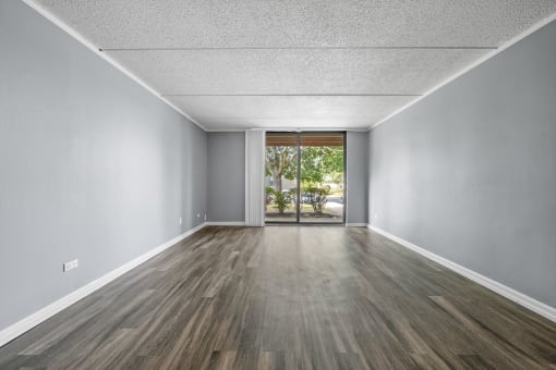 Renovated Living Room with white interior decor at Woodland Ridge Apartments in Woodridge, IL