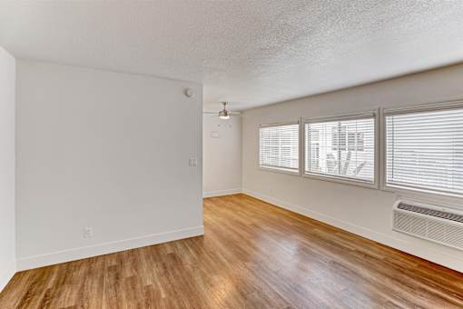 A room with wooden floors and white walls.