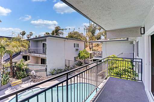 A second floor balcony facing the pool