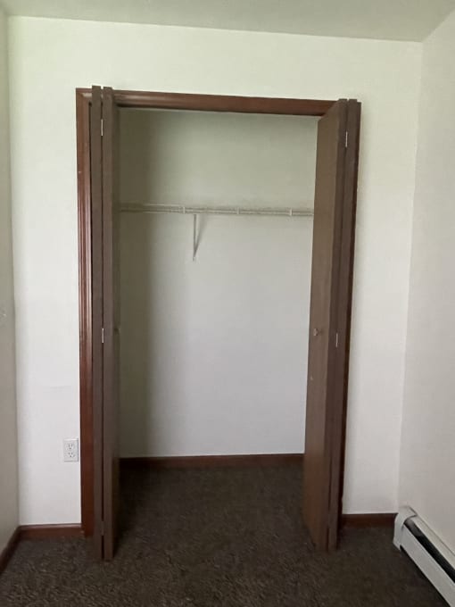 an empty medicine cabinet with a glass door