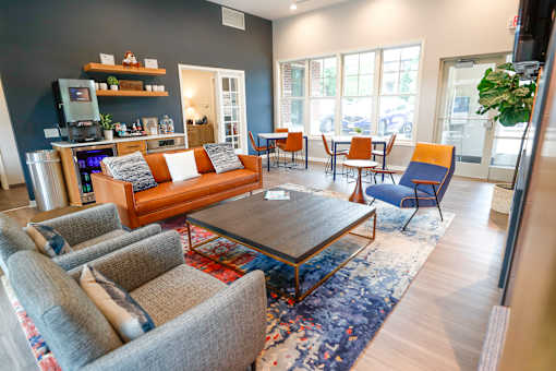 A living room with a grey sofa and a coffee table.