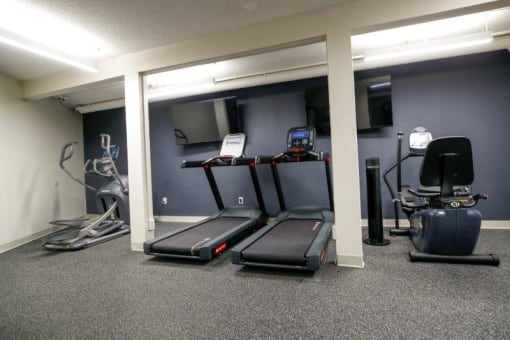 a room filled with lots of exercise equipment