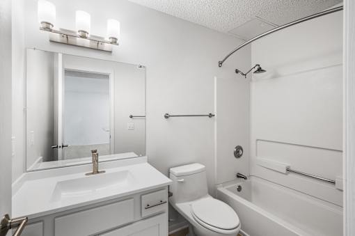 a bathroom with a sink toilet and a bath tub