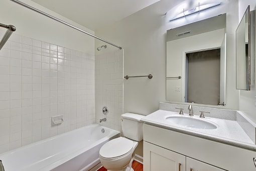 a bathroom with a sink toilet and a bath tub