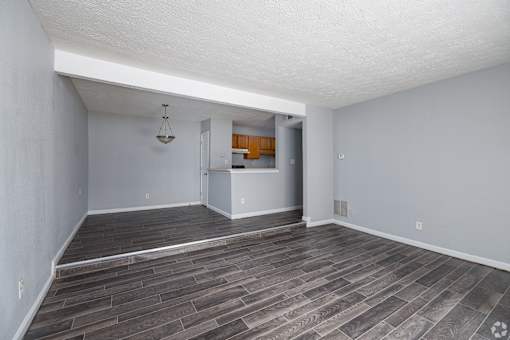 A room with a grey floor and white walls.