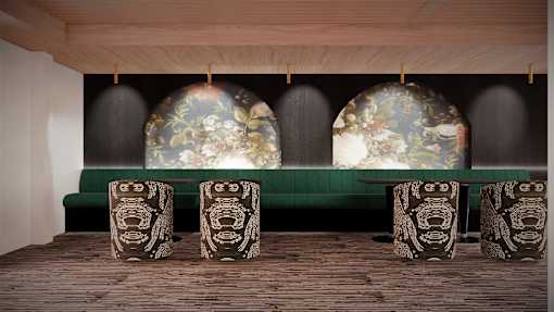 A room with a green sofa and a table with a floral design.