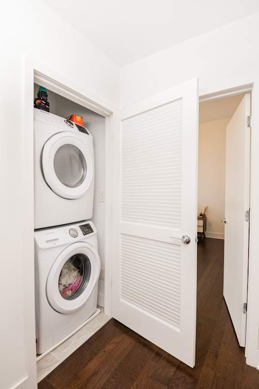 A white door is open to a hallway.