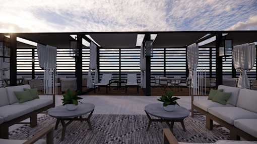 A modern outdoor living space with a wooden floor, white furniture, and a striped rug.