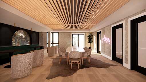 A modern living room with a wooden ceiling and a green sofa.