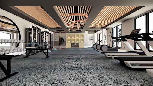 A gym with a variety of equipment including treadmills, weights, and exercise machines.
