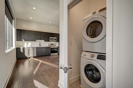 A modern laundry room with a washer and dryer.