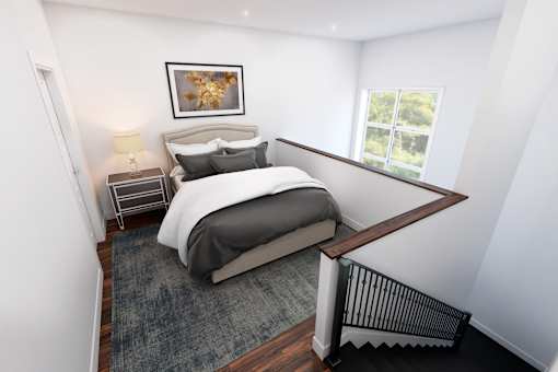 A bedroom with a large bed and a window.