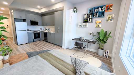 A modern kitchen with a dining table and chairs.