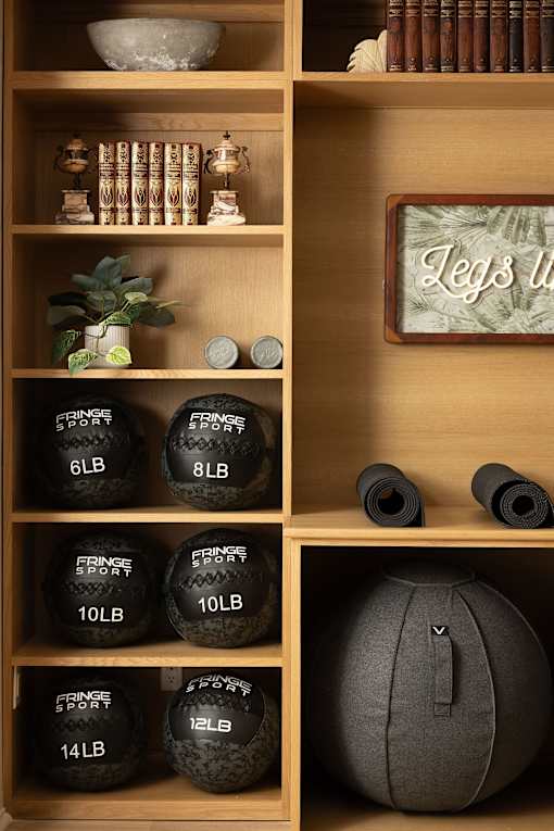 A shelf with exercise equipment and a sign at The PARKER on E Mulberry Apartments, Texas