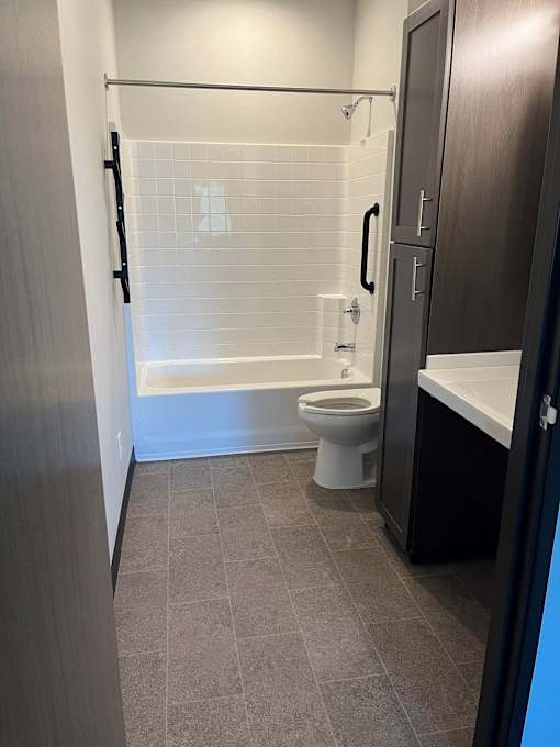 a bathroom with a toilet sink and bathtub