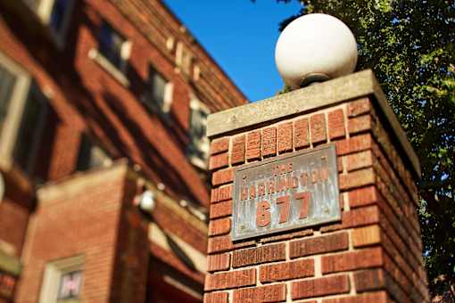 a brick pillar with a sign on it that reads the harrington 617