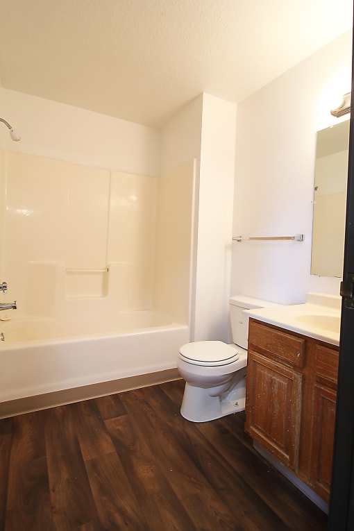 a bathroom with a toilet sink and bathtub
