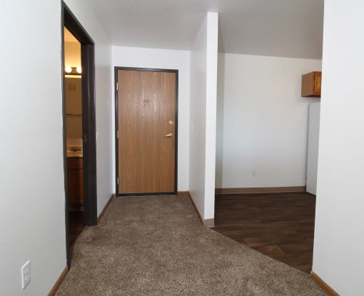 a view of a door from the living room into the kitchen