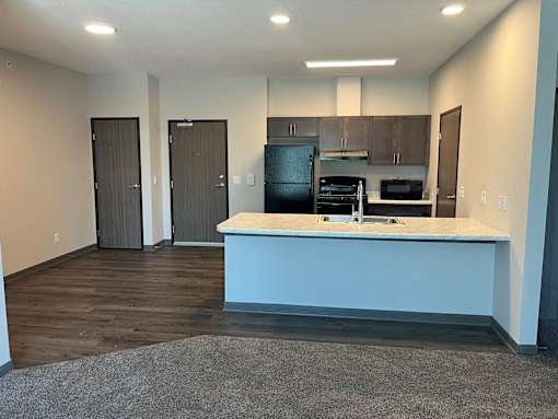 a kitchen with an island and a sink
