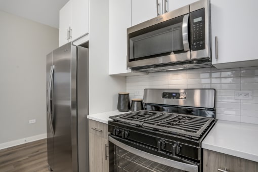 a kitchen with stainless steel appliances and a stainless steel refrigerator at Beekman on Broadway, Michigan, 48105