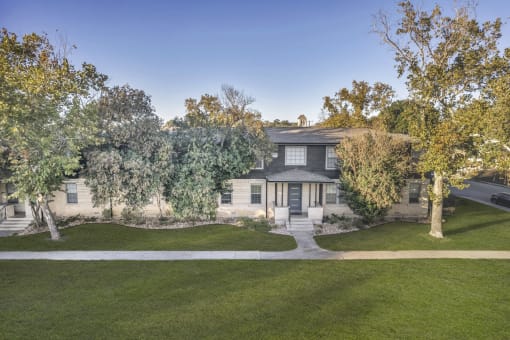 the front of a house with trees and a sidewalk  at Sunset Ridge, San Antonio, TX, 78209