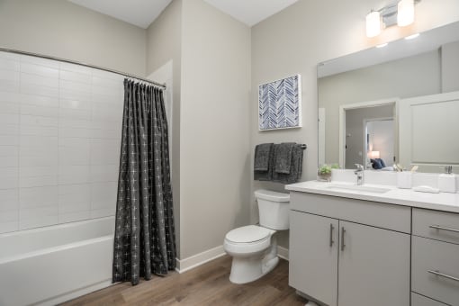 an open bathroom with a shower toilet and sink at Beekman on Broadway, Ann Arbor, MI