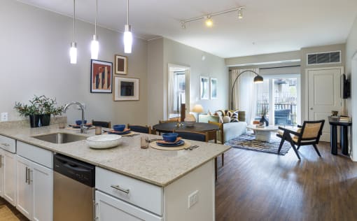 an open floor plan with a kitchen island and living room in the background  at Elmhurst 255, Illinois, 60126