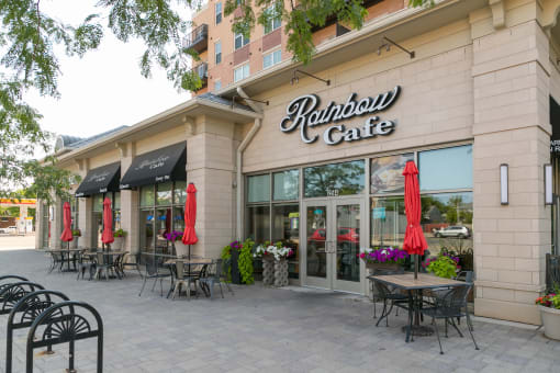 the exterior of a restaurant with tables and chairs  at Elmhurst 255, Illinois