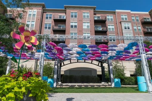 colorful umbrellas in front of an apartment building  at Elmhurst 255, Elmhurst, IL, 60126