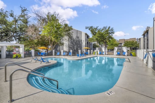 the swimming pool at the enclave apartments