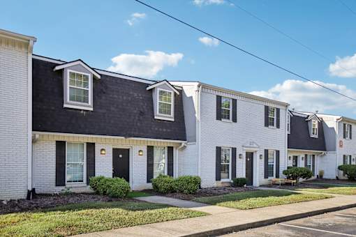 A row of houses with white and black exteriors.