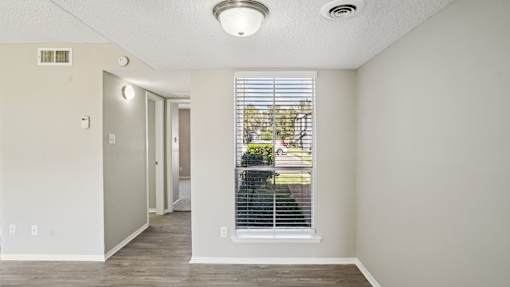 A room with a window and a door at Keller Oaks, Carrollton, 75006