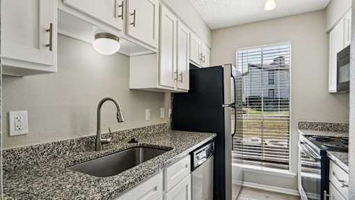 Kitchen with sink at Keller Oaks, Carrollton, 75006