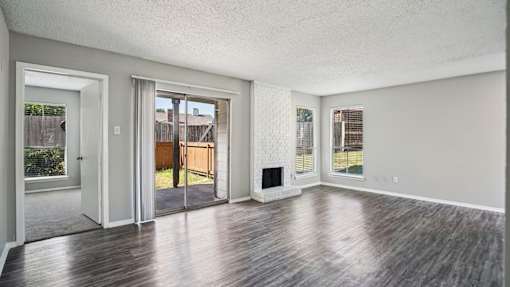 Room with wooden floor at Keller Oaks, Carrollton, TX
