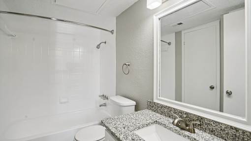Bathroom with large mirror at Keller Oaks, Carrollton, TX 75006