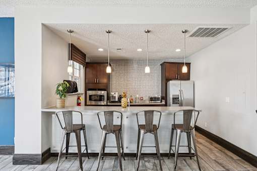 Kitchen with bar area and bar stools at Radbourne Lake Apartments, Charlotte, North Carolina