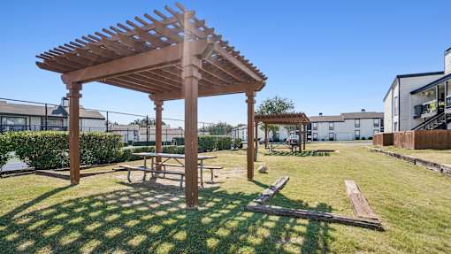 Wooden pergola with bench at Keller Oaks, Carrollton, Texas