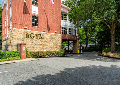 A gym is located in a red brick building.
