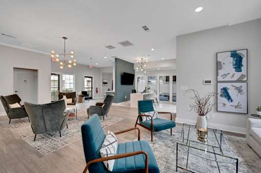A living room with a blue chair in the foreground.