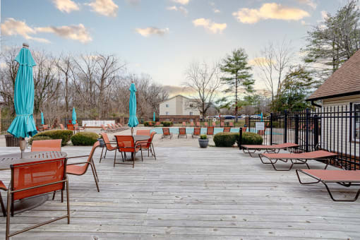an outdoor deck with tables and chairs and umbrellas at The Grove Brentwood, Nashville Tennessee?