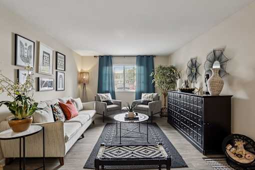 Living room with white sofa at The Brentwood, Nashville
