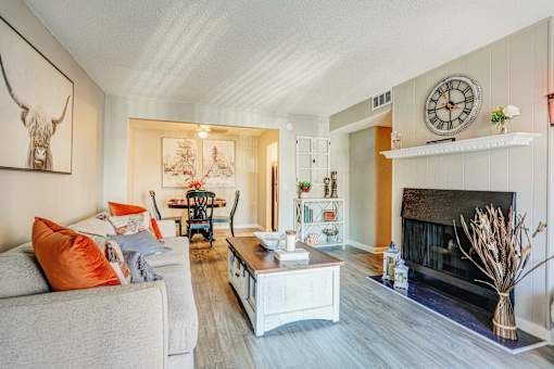 A living room with a fireplace and a couch.