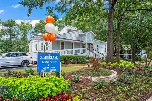 a house with a sign in front of it