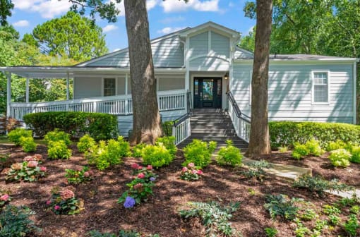 a house with a large tree in front of it