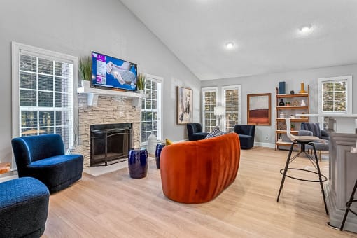 a living room with a fireplace and a tv above it