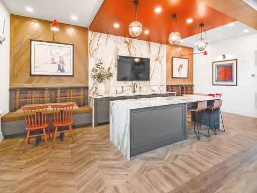 a restaurant with a kitchen and a table and chairs