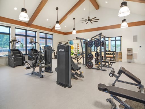 the residence apartments fitness room with exercise equipment