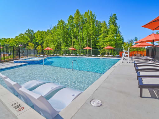 the reserve at city center spacious pool with chairs and umbrellas