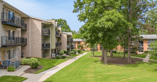 our apartments offer a green lawn and trees for residents to enjoy